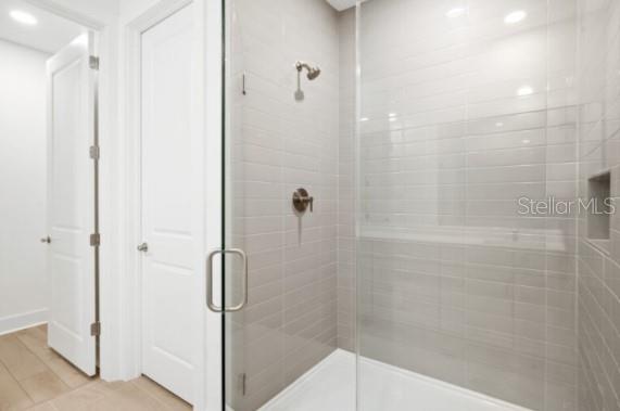 9973 Key Haven Road Seminole, FL 33777 - Photo 35 of 59 a bathroom with a glass shower door