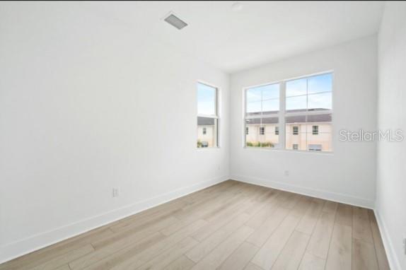 9973 Key Haven Road Seminole, FL 33777 - Photo 36 of 59 a view of an empty room with wooden floor and a window