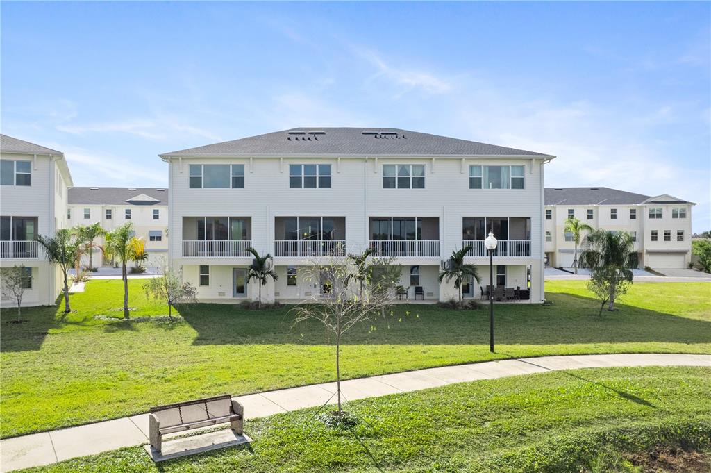 9973 Key Haven Road Seminole, FL 33777 - Photo 39 of 59 a view of a house with a backyard porch and sitting area