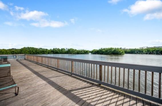 9973 Key Haven Road Seminole, FL 33777 - Photo 51 of 59 a view of balcony with wooden floor and fence