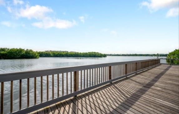 9973 Key Haven Road Seminole, FL 33777 - Photo 54 of 59 a balcony with wooden floor and lake view