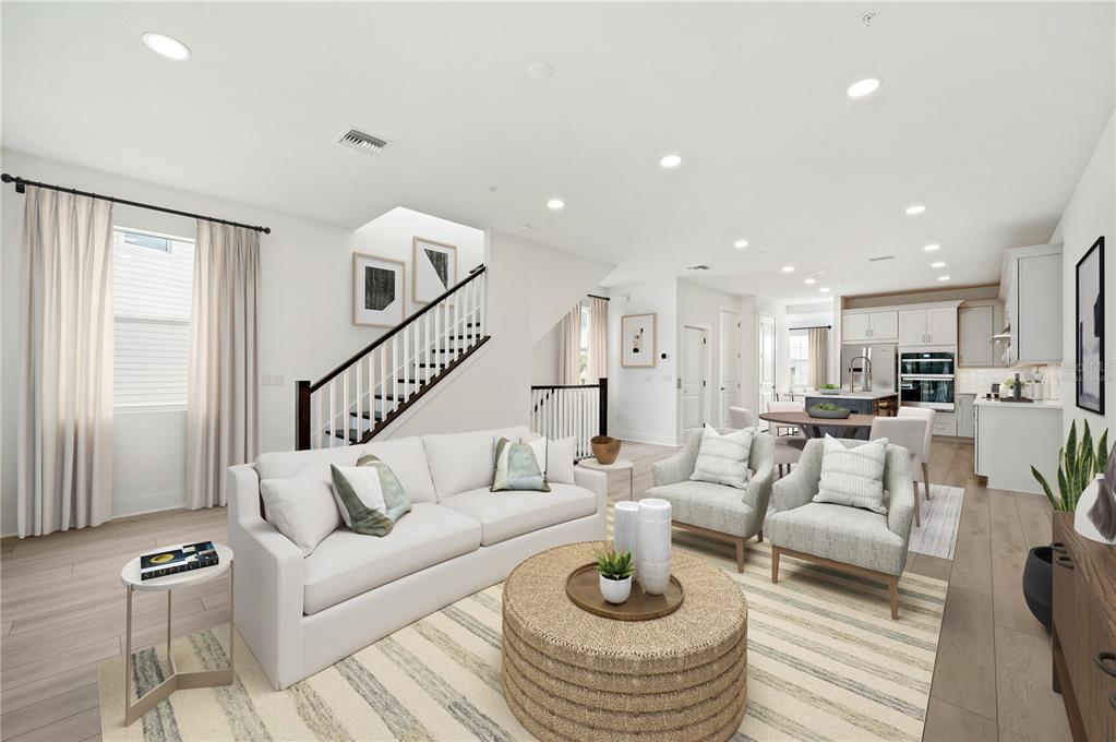 9973 Key Haven Road Seminole, FL 33777 - Photo 6 of 59 a living room with furniture kitchen view and a wooden floor