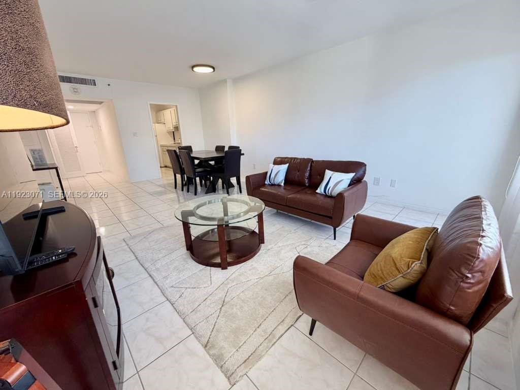 100 Lincoln Road, Unit 541 Miami Beach, FL 33139 - Photo 4 of 17 a living room with furniture and a couch