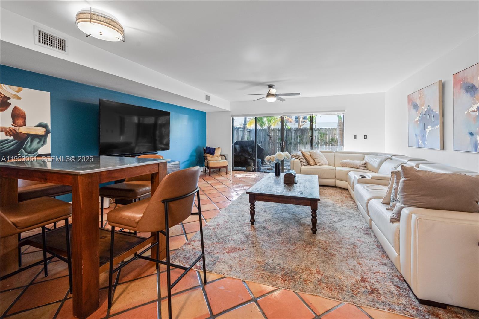 a living room with furniture and a flat screen tv