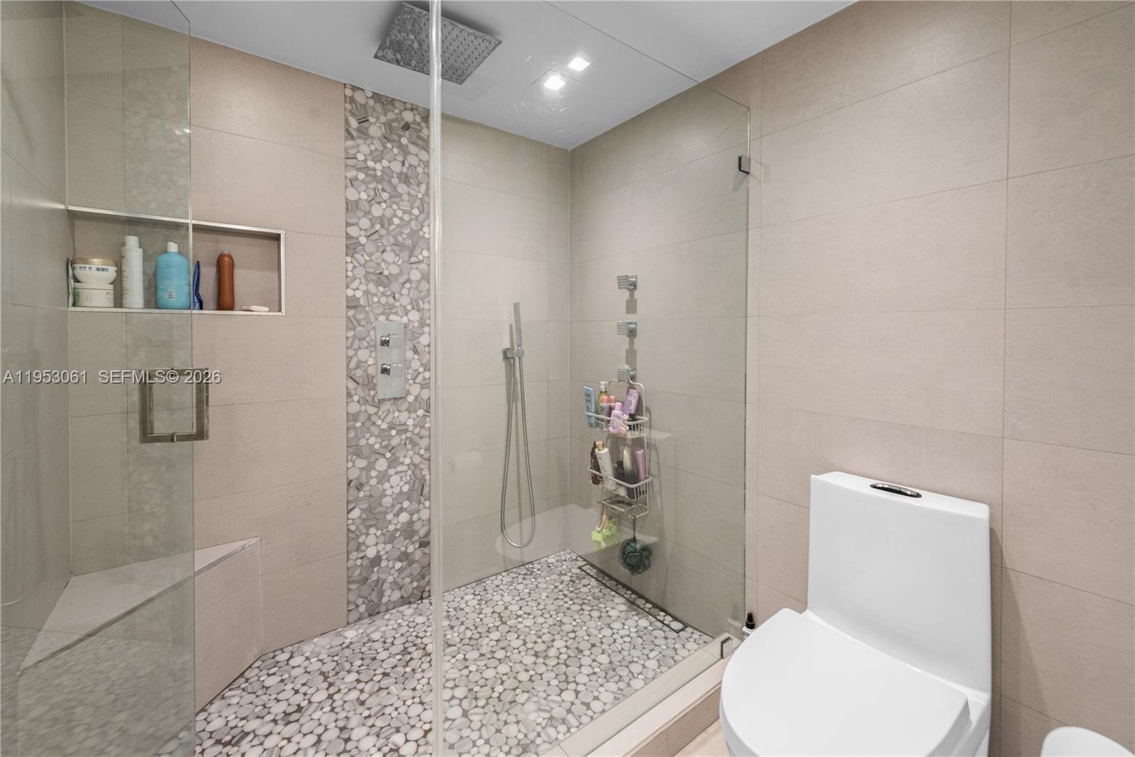7890 Southwest 86th Street, Unit 10 Miami, FL 33156 - Photo 15 of 32 a bathroom with a toilet and a shower