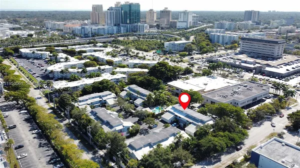 an aerial view of city and lake