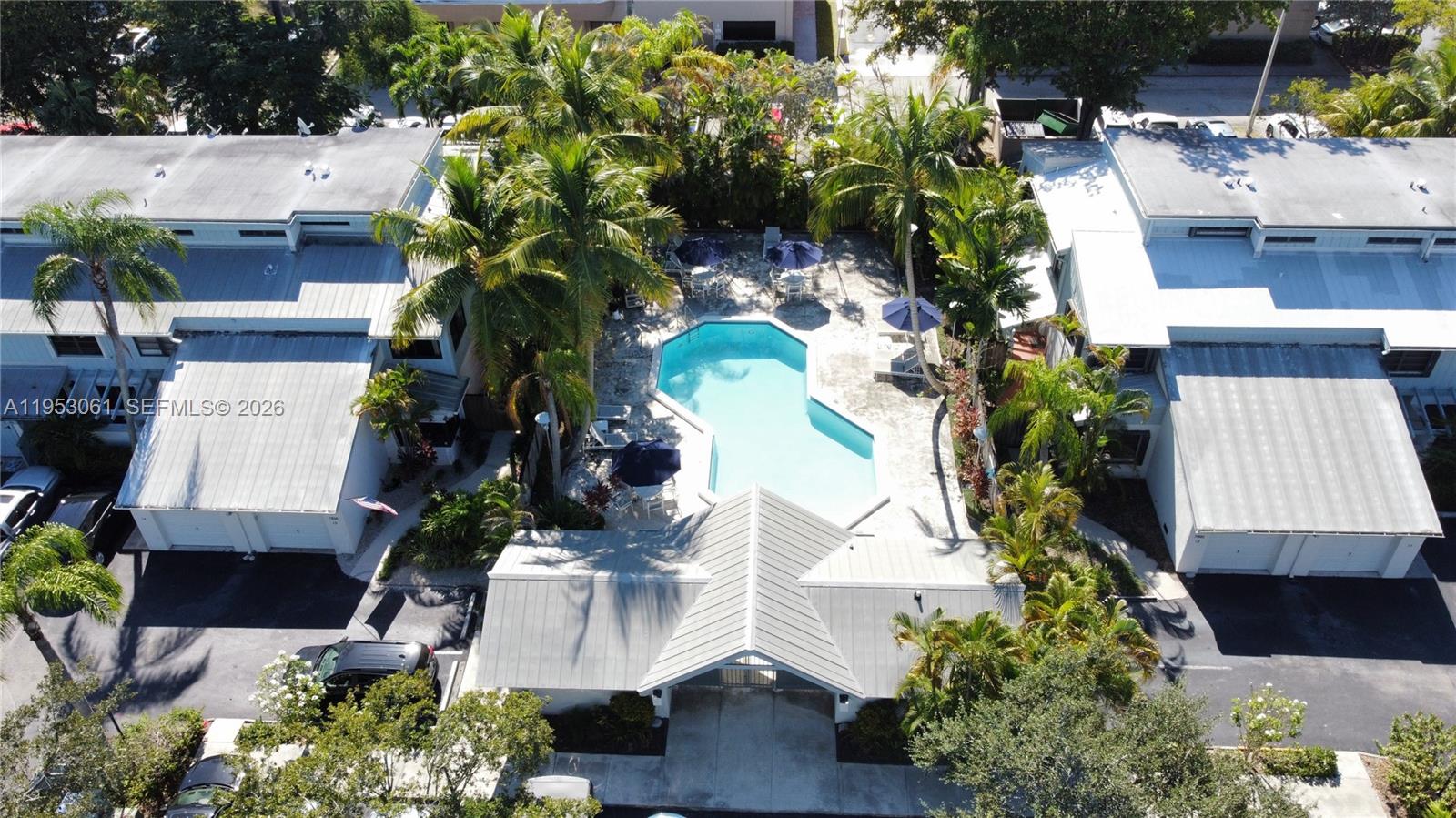 7890 Southwest 86th Street, Unit 10 Miami, FL 33156 - Photo 31 of 32 an aerial view of a house with a yard and garden