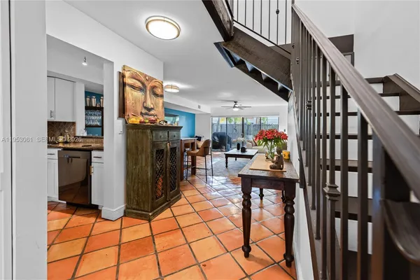a living room with lots of furniture and a chandelier