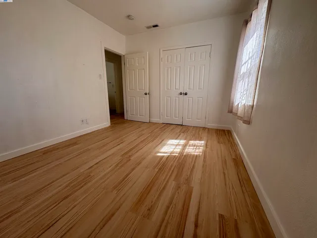 a view of wooden floor in an empty room