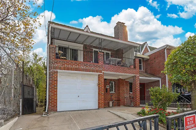 a front view of a house with a garage