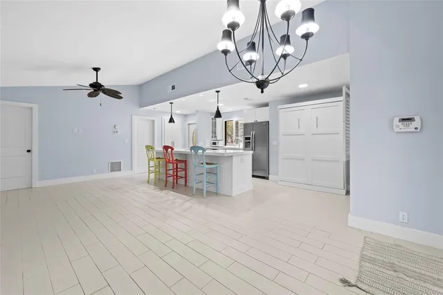 a view of a livingroom with a kitchen