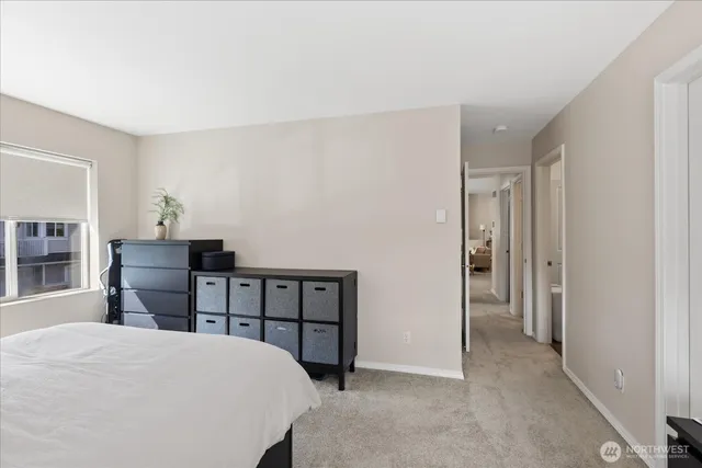 a bedroom with a bed and a table in it