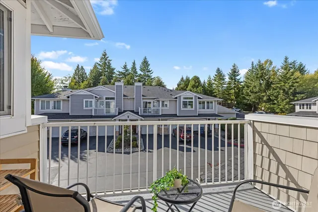 a view of a chair and table in the balcony