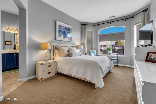 a view of yard from deck with patio