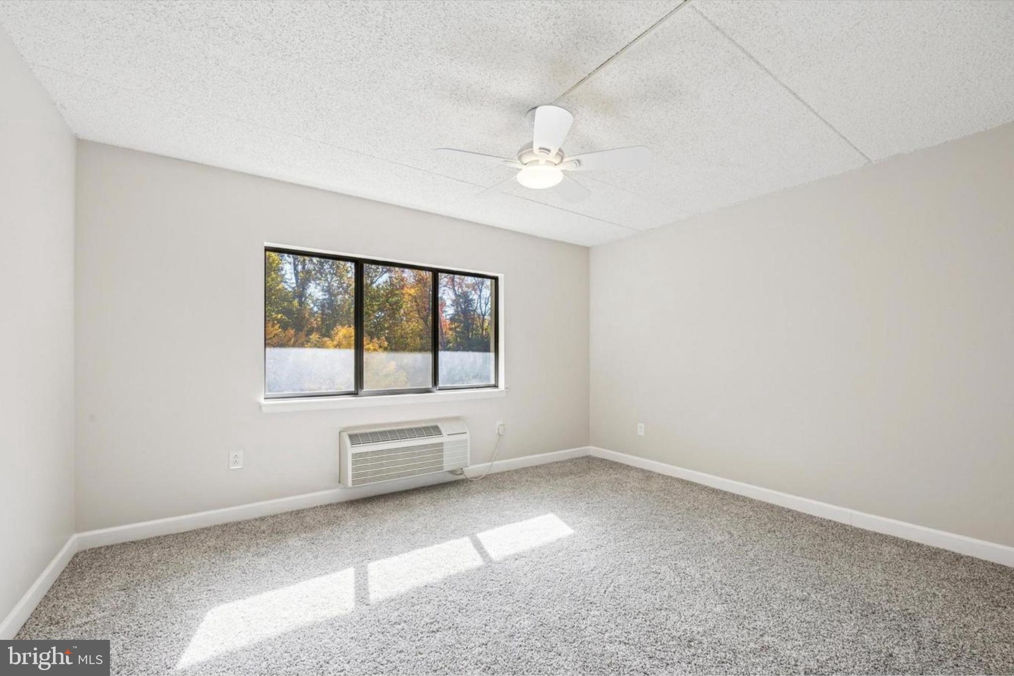 800 Avondale Road, Unit 7B Wallingford, PA 19086 - Photo 11 of 24 wooden floor in an empty room with a window
