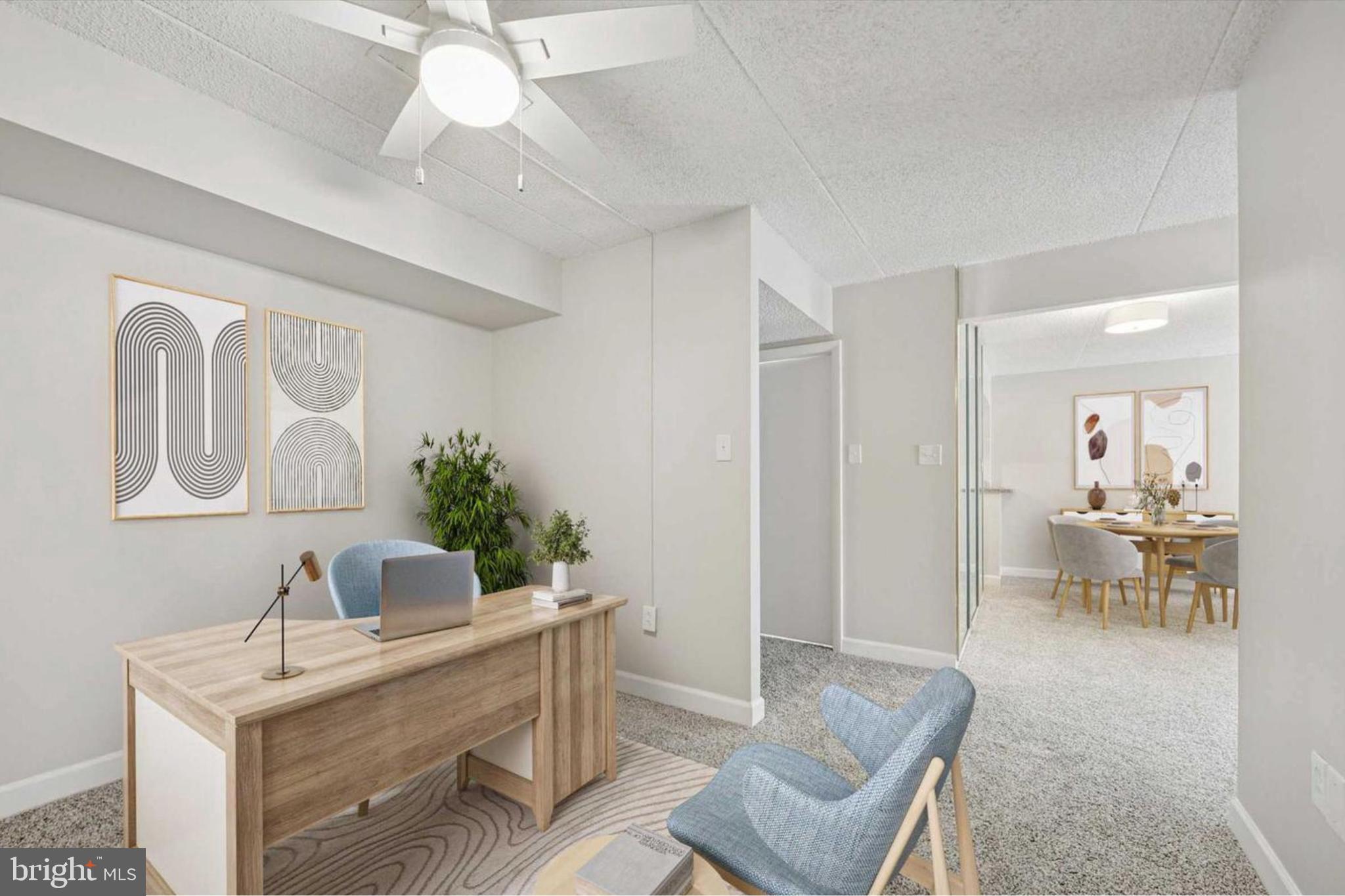 800 Avondale Road, Unit 7B Wallingford, PA 19086 - Photo 7 of 24 a living room with furniture and a potted plant