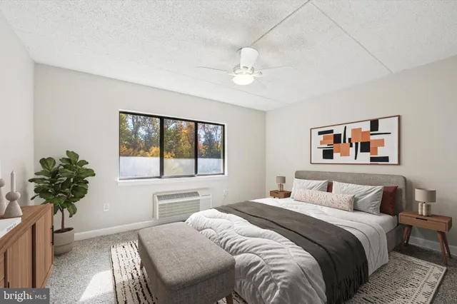 a bedroom with a large bed and a window