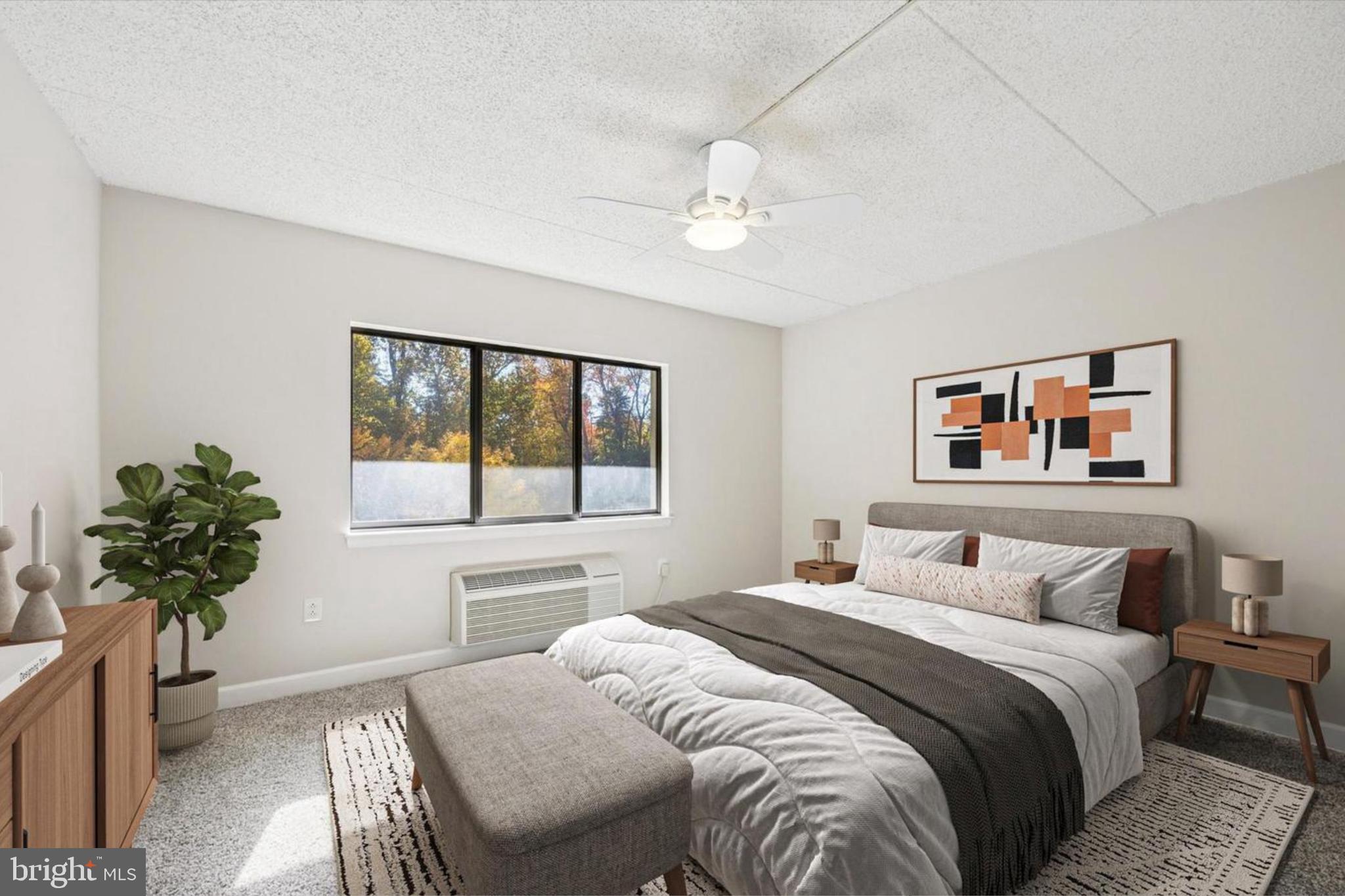 800 Avondale Road, Unit 7B Wallingford, PA 19086 - Photo 10 of 24 a bedroom with a large bed and a window