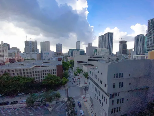 a view of a city with tall buildings