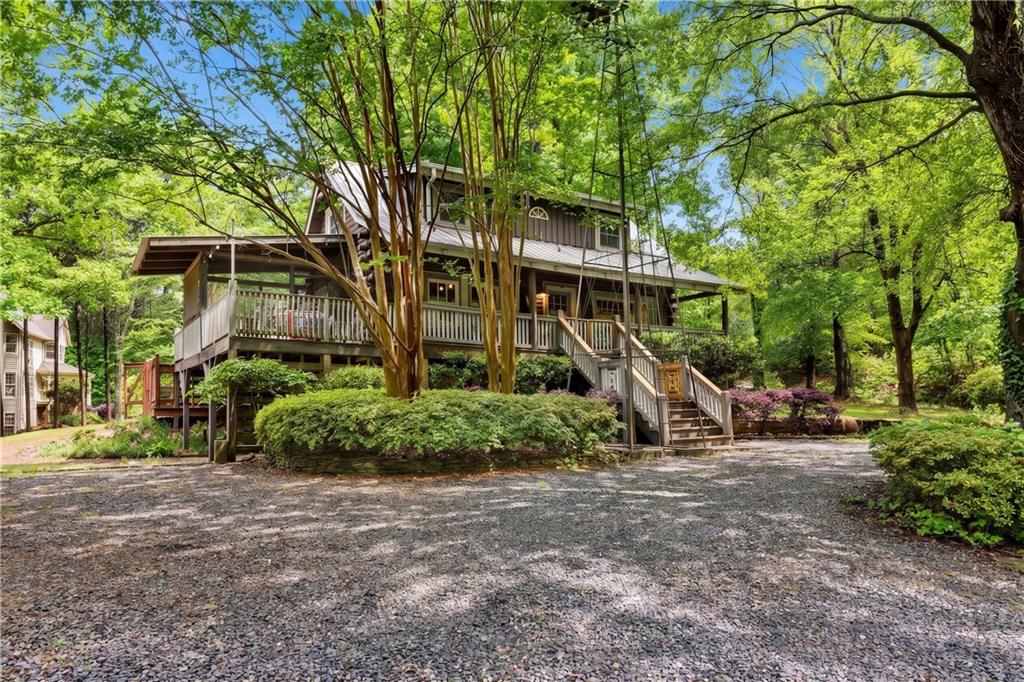 3582 Casteel Road Marietta, GA 30062 - Photo 1 of 55 a front view of a house with a yard