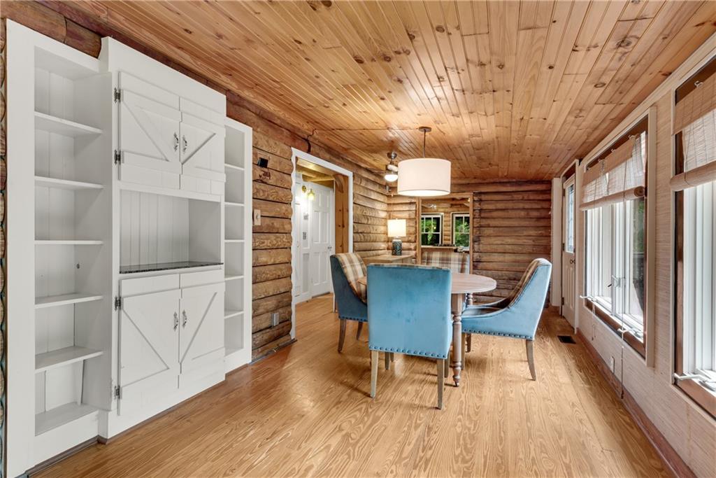 3582 Casteel Road Marietta, GA 30062 - Photo 17 of 55 a view of a dining room with furniture window and wooden floor