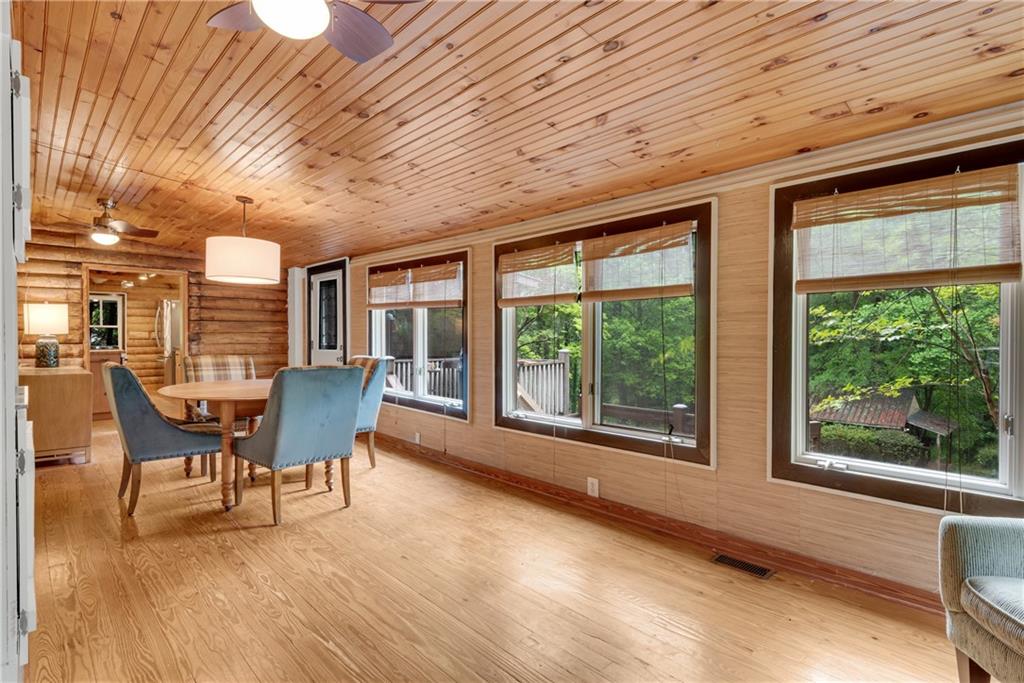 3582 Casteel Road Marietta, GA 30062 - Photo 18 of 55 a view of a dining room with furniture large windows and wooden floor