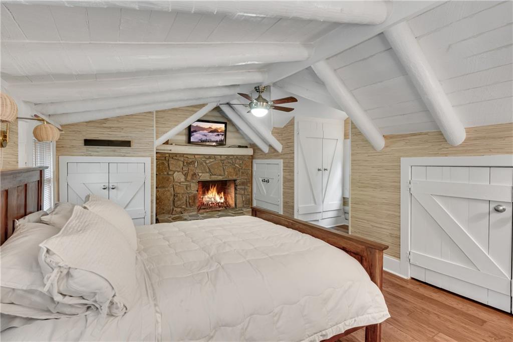 3582 Casteel Road Marietta, GA 30062 - Photo 19 of 55 a bedroom with a bed and a fireplace