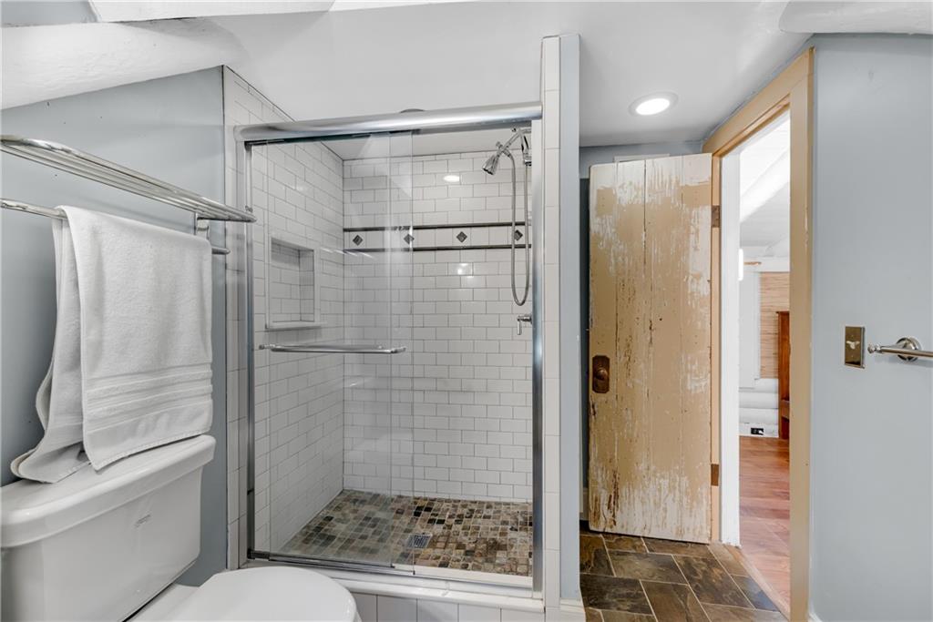 3582 Casteel Road Marietta, GA 30062 - Photo 23 of 55 a bathroom with a shower and a toilet
