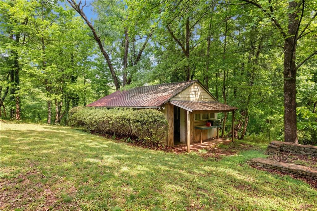 3582 Casteel Road Marietta, GA 30062 - Photo 31 of 55 a backyard of a house with table and chairs