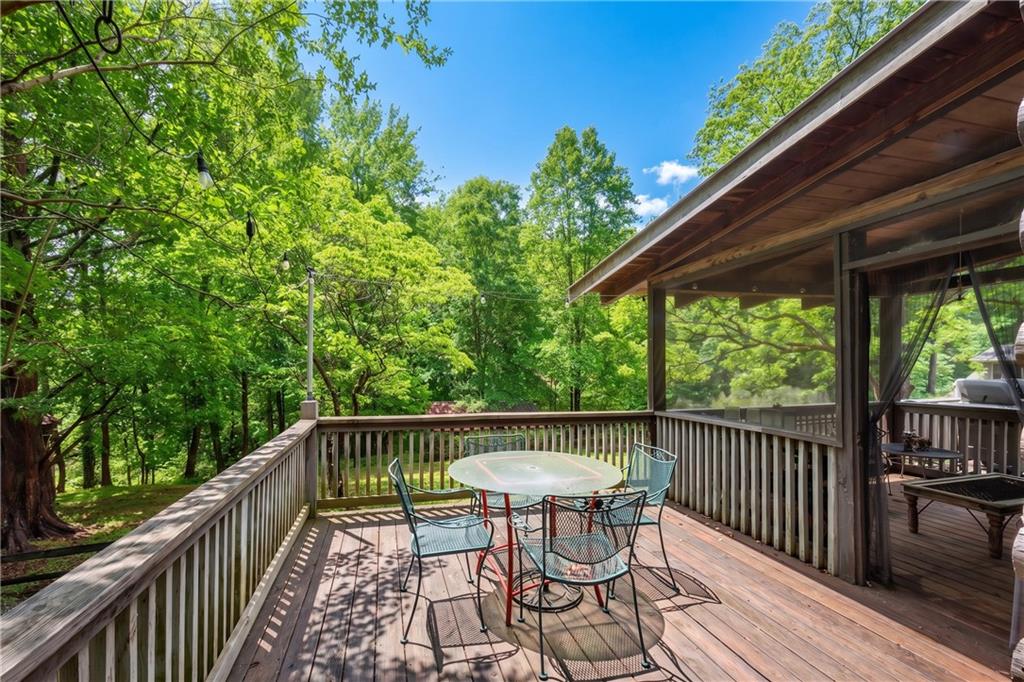 3582 Casteel Road Marietta, GA 30062 - Photo 34 of 55 a view of a chair and table on the deck