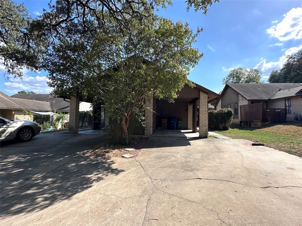 903 Milford Way, Unit B Austin, TX 78745 - Photo 1 of 1 a street view with residential houses and car parked