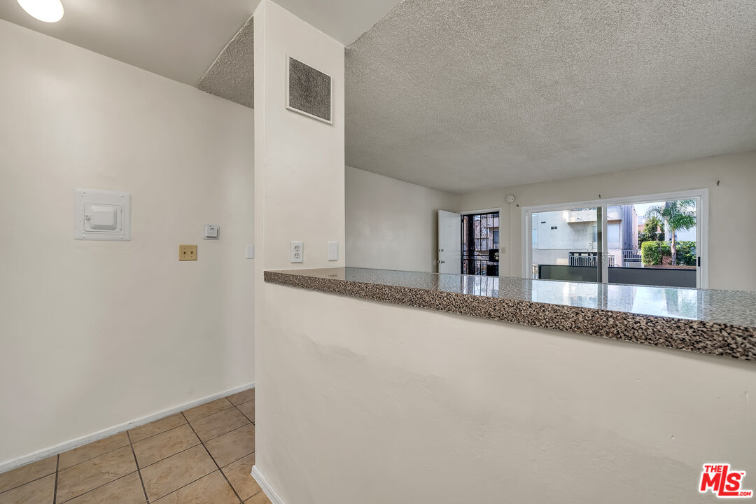 4956 Romaine Street Los Angeles, CA 90029 - Photo 16 of 25 a view of a livingroom and a kitchen counter space