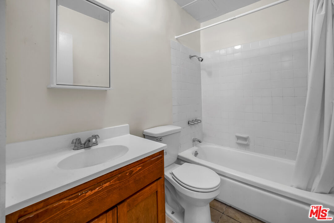 4956 Romaine Street Los Angeles, CA 90029 - Photo 20 of 25 a bathroom with a sink a toilet and shower