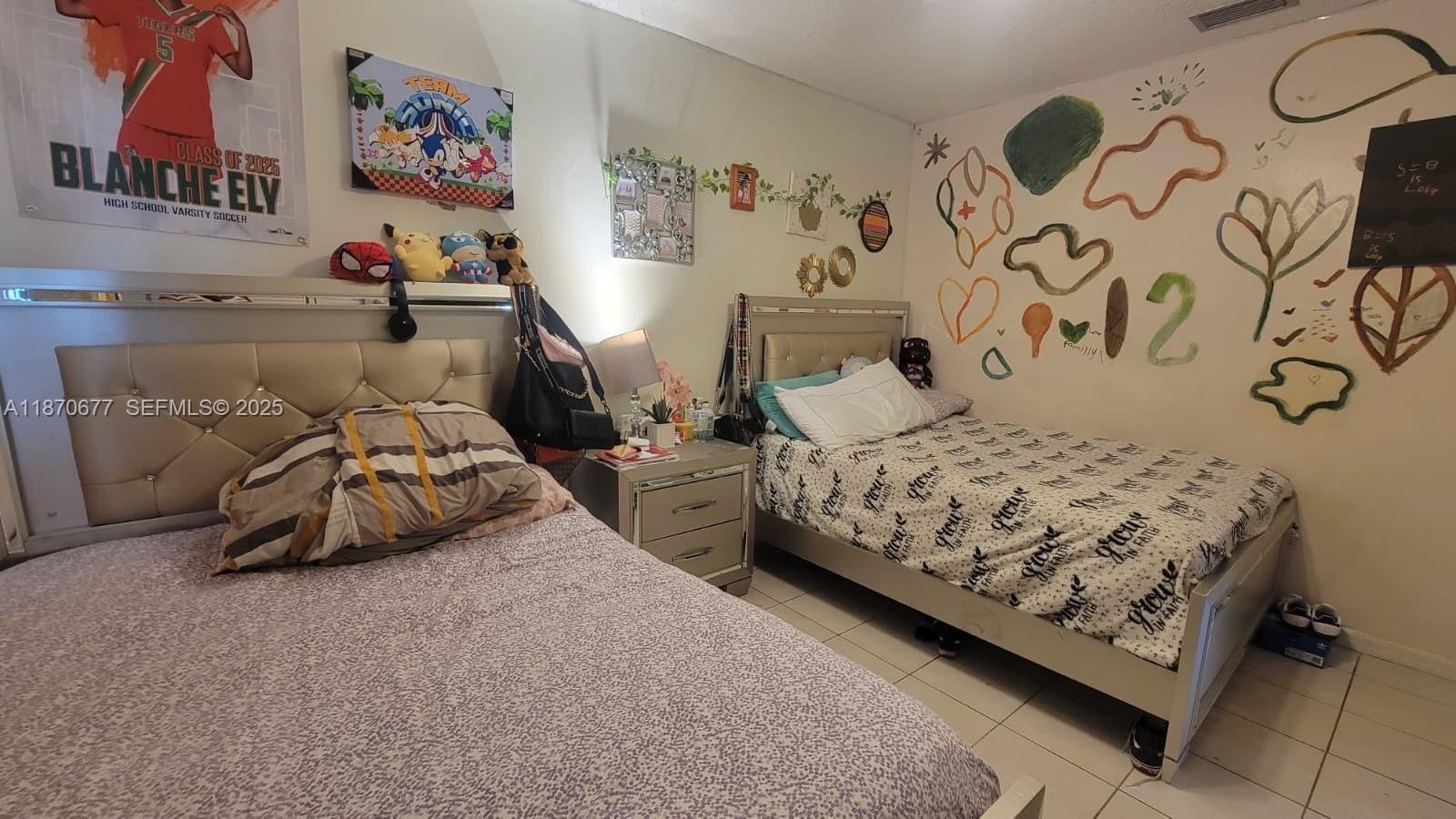715 Banks Road Margate, FL 33063 - Photo 16 of 24 a bedroom with bed and cupboard