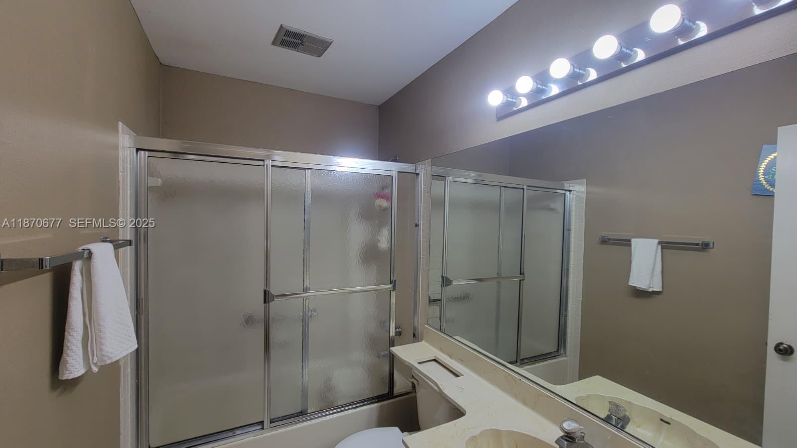 715 Banks Road Margate, FL 33063 - Photo 18 of 24 a bathroom with a shower and toilet