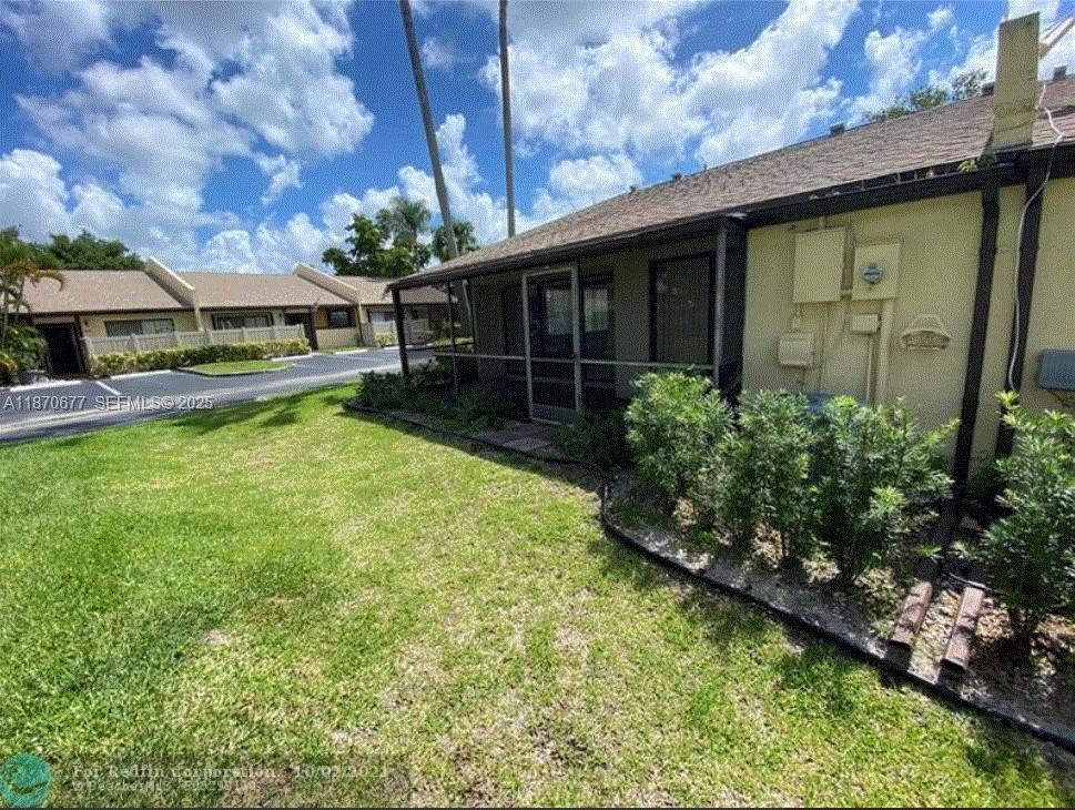 715 Banks Road Margate, FL 33063 - Photo 2 of 24 front view of a house with a yard