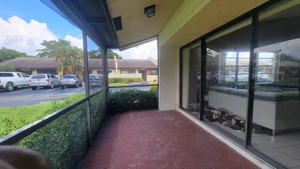 a view of a livingroom with furniture window and wooden floor
