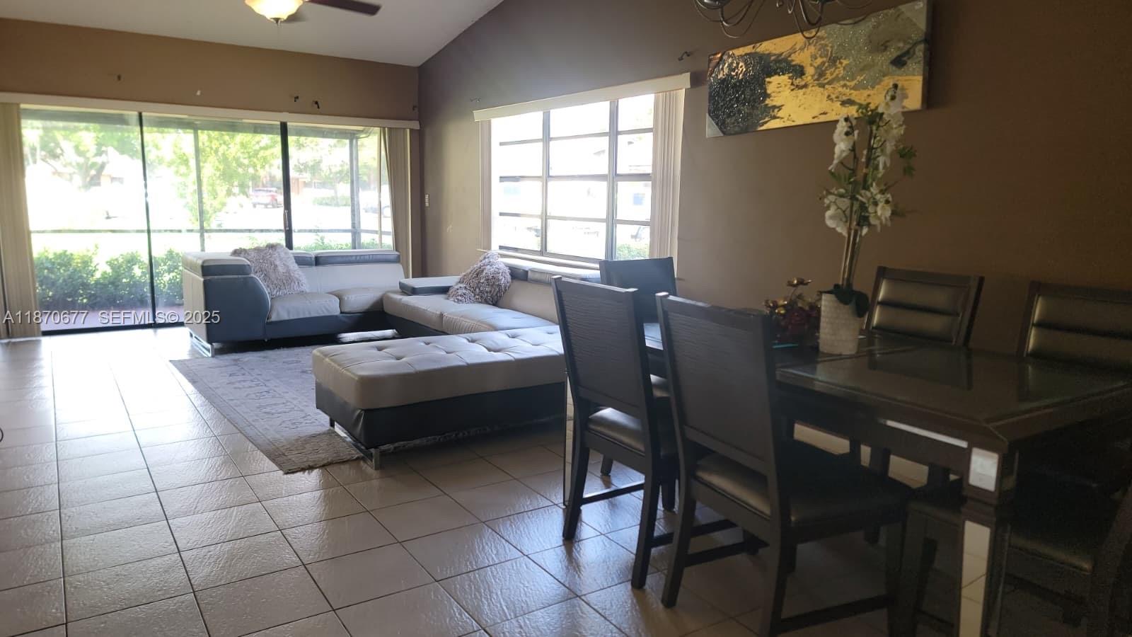715 Banks Road Margate, FL 33063 - Photo 5 of 24 a living room with furniture and a window