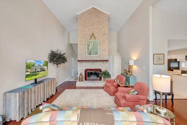 a living room with furniture and a fireplace