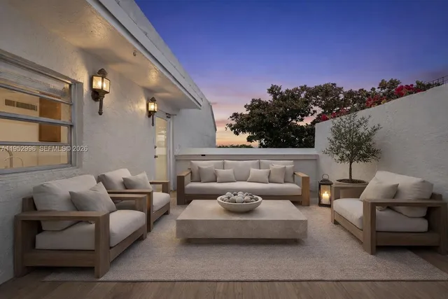 a outdoor living space with furniture and a potted plant