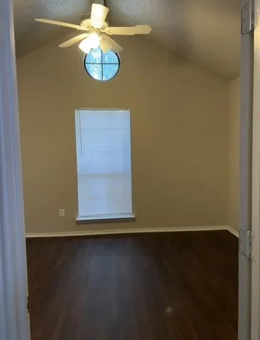 a view of wooden door and chair in a room