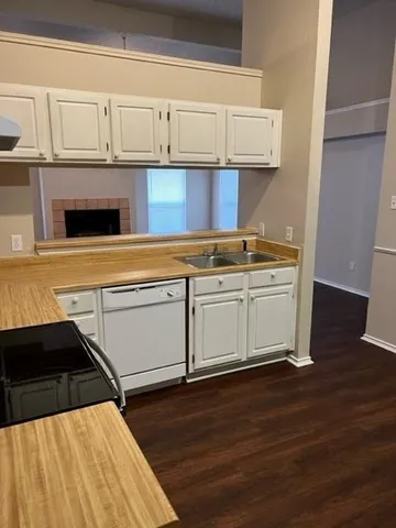 a kitchen with stainless steel appliances granite countertop a sink and cabinets