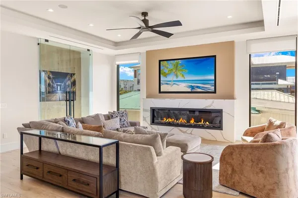 a living room with furniture and a flat screen tv