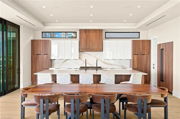 a kitchen with a table and chairs in it
