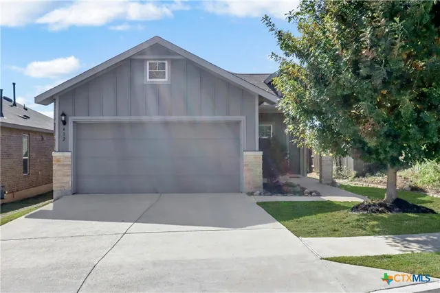 a house with yard in front of it