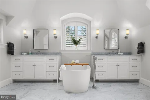 a bed room with a bed and a window