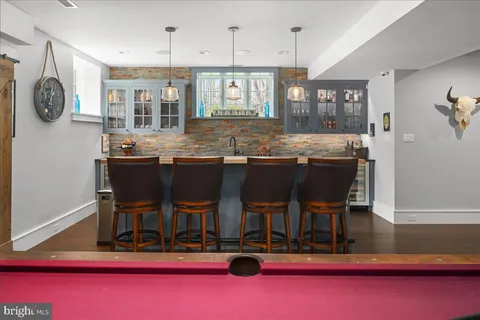 a view of dining room with furniture and wooden floor
