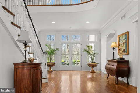 a view of an entryway with wooden floor