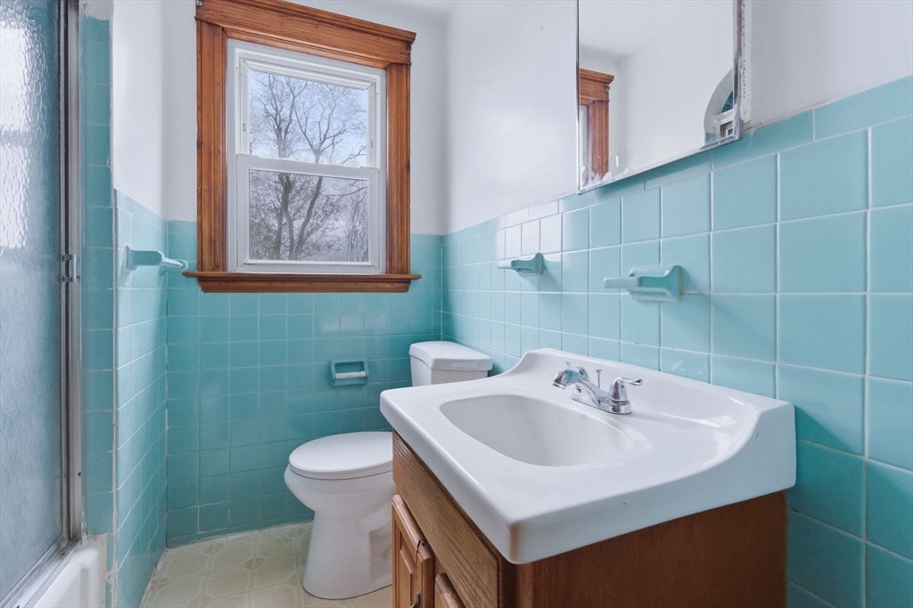 7 3rd Avenue Dudley, MA 01571 - Photo 11 of 42 a bathroom with a sink and a toilet