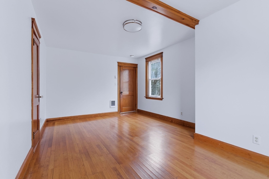 7 3rd Avenue Dudley, MA 01571 - Photo 13 of 42 a view of a room with wooden floor and window